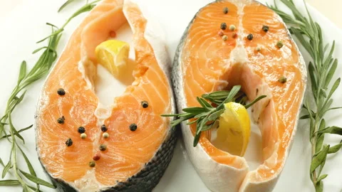Salmon. Raw Trout Red Fish Steak with Herbs and Lemon. Cooking Salmon, sea food. Stock Footage 97797403