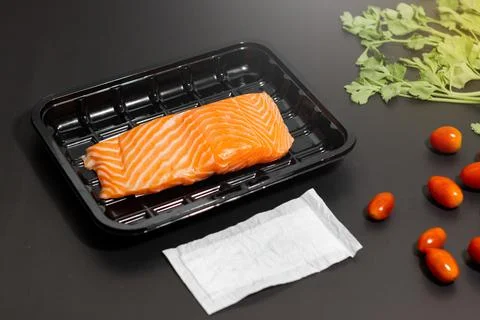 Salmon run stock on plastic packaging with food absorbent in supermarket, Goo Stock Photos