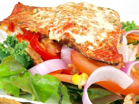 Salmon on salad Stock Photos