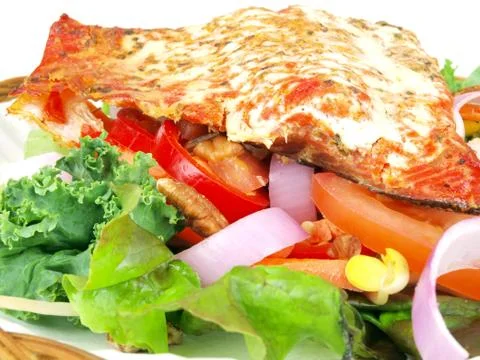 Salmon on salad Stock Photos