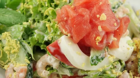 Salmon salad with prawns, closeup (loop) Stock Footage 56849224