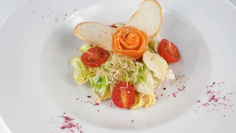 Salmon salad with tomatoes, crispy bread and parmesan cheese Stock Footage 94255449