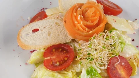 Salmon salad with tomatoes, crispy bread and parmesan cheese Stock Footage 94318430