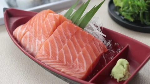 Salmon sashimi slice on red plate. Stock Footage 157394301