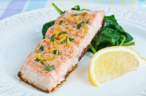 Salmon with spinach Stock Photos