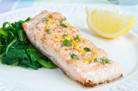 Salmon with spinach Stock Photos