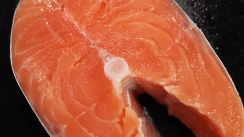 Salmon steak close-up on a dark background. Stock Footage 140798074