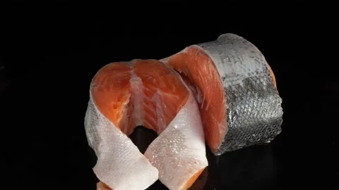 Salmon steak close-up on a dark background. Stock Footage 140843346