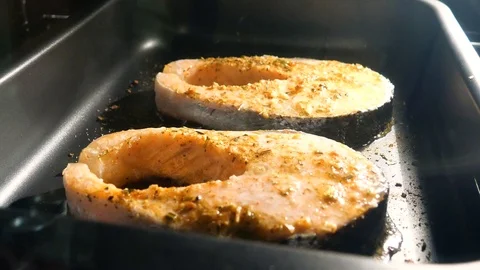 Salmon steak is cooked in the oven. Stock Footage 116613985