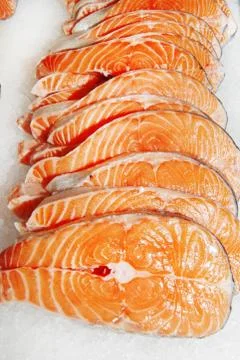 Salmon steaks on white background Stock Photos