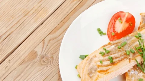 Salmon steaks on white dish with red caviar Video stock 88919066