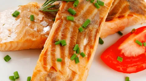 Salmon strips on white dish 库存影片 37284030