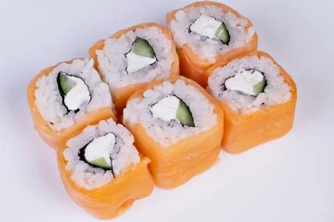 Salmon sushi presentation. Elegant plating of vibrant salmon and fresh ingredien Stock Photos