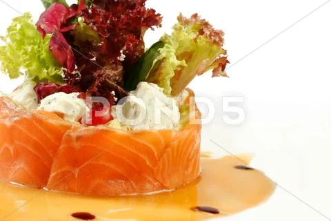 Salmon under sour cream closeup Stock Photos