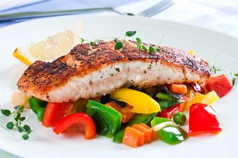 Salmon with vegetables Stock Photos