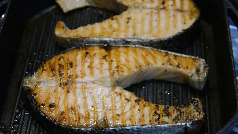 Salomon steak on grill pan. close up selective focus. Stock Footage 120572402