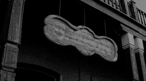 Saloon Sign in Western Town Close-up in Black & White Stock Photos