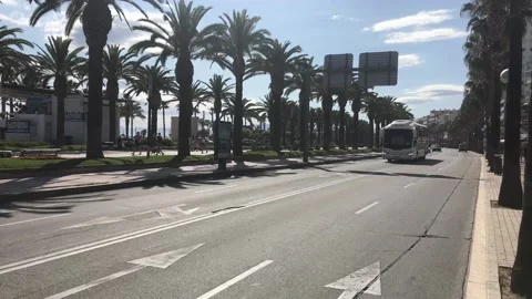 Salou, Spain, An empty road with trees on the side of a building Video stock 134076671
