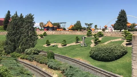 Salou, Spain, A train on a train track with trees in the background Stock Footage 134076930