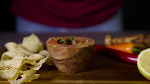 Salsa and Chips on a table Vídeos de archivo 243487149