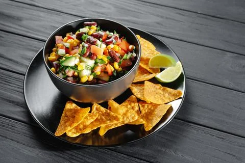 Salsa with corn and beans. Not traditional salsa with chips on a dark background 库存照片