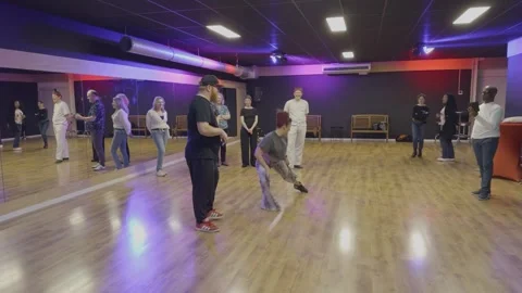 Salsa Dance Instructors Teaching Students in Modern Studio Stock Footage 333769843