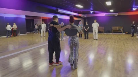 Salsa Dance Instructors Teaching Students in Modern Studio Stock Footage 334585128