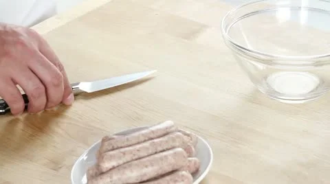 Salsiccia being skinned Stock Footage 24672590