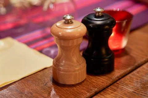 Salt and pepper box on a table Stock Photos