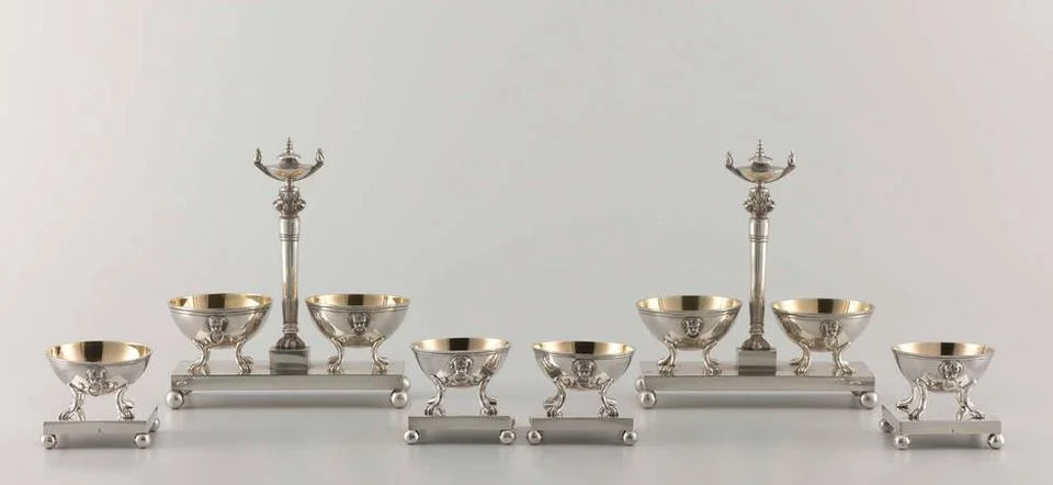 . Salt barrel of silver. On a rectangular, the pedestal worn on four bolba... Stock Photos