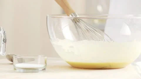 Salt being added to a liquid dough Video stock 24635161