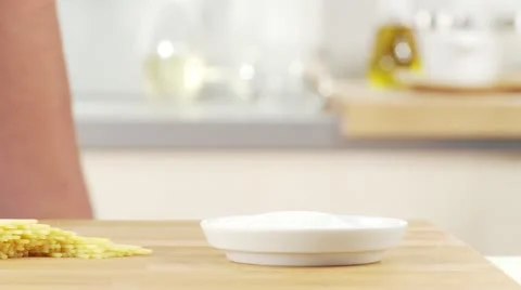 Salt being added to a pot Video stock 24634677