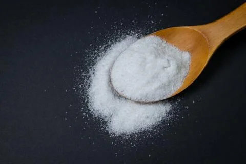 Salt on a black background. Stock Photos