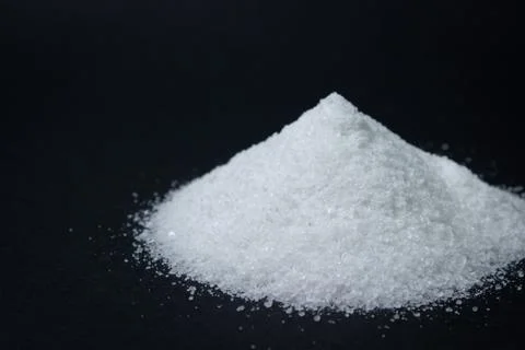 Salt on a black background. Stock Photos
