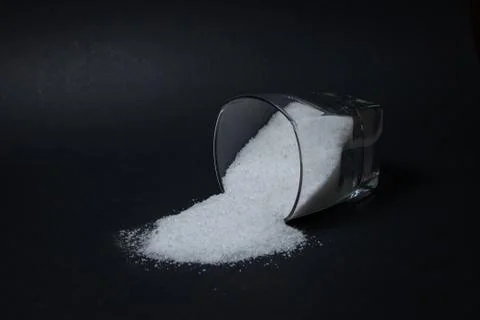 Salt on a black background. Stock Photos