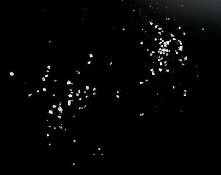 Salt on black Stock Photos