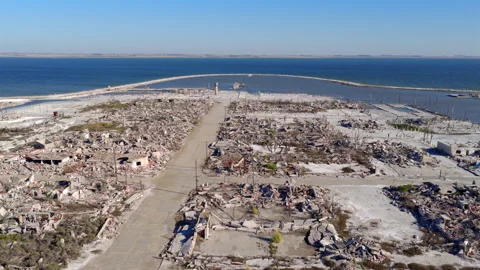 Salt-bleached ruins to stone pier and blue lake, Villa Epecuén, Buenos Aires Stock Footage 320668392