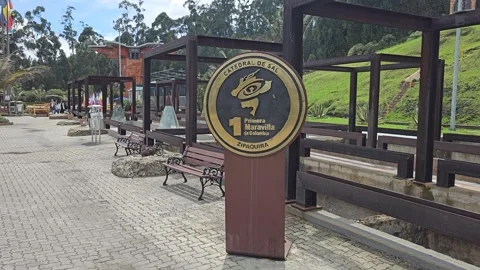 Salt Cathedral Round Sign Post on Paved Plaza, Catedral de Sal, Colombia 8K Stock Footage 331524904