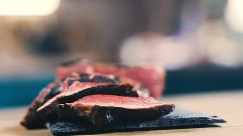 Salt close-up sips on a piece of fresh raw beef meat Stock-Footage 107740462