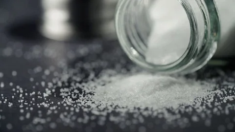 Salt Container Salt Spill Turning Away from Opening on Black Stock Footage 80208650