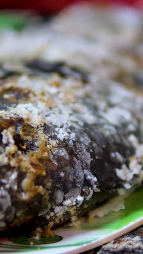 Salt-Crusted fish tilapia cooking on a grill with vegetables, selling at the Stock Footage 313809596