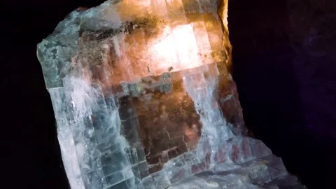 The salt crystal is illuminated by light Stock Footage 166573395