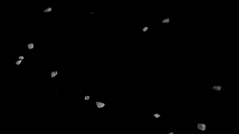 Salt crystals fall on a black surface. Stock Footage 249202770