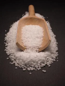 Salt on dark slate Stock Photos