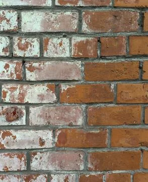 Salt destroys the brickwork of the wall of an old building, close-up. Stock Photos