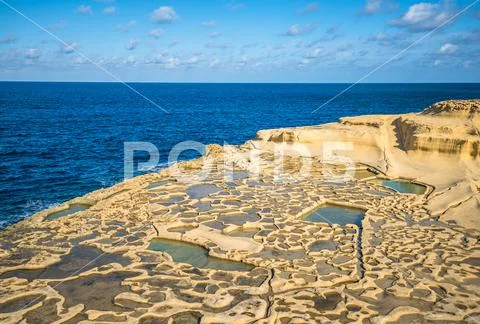 Salt evaporation ponds on Gozo island, Malta Stock Photos