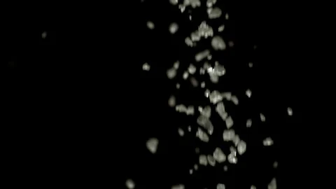 Salt falling from above on a black background 4K 1000FPS Video stock 90898611