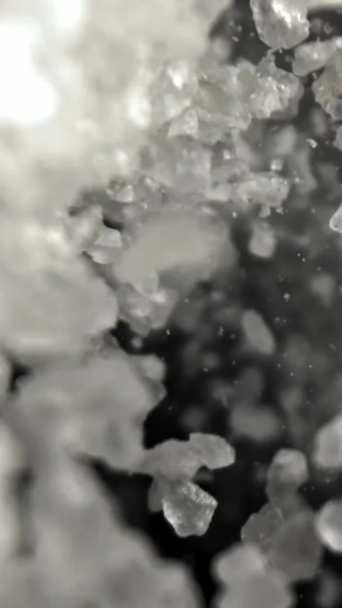Salt falls down. Filmed on a high-speed camera at 1000 fps Stock Footage 335381979