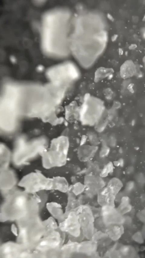 Salt falls down. Filmed on a high-speed camera at 1000 fps Stock Footage 335384851