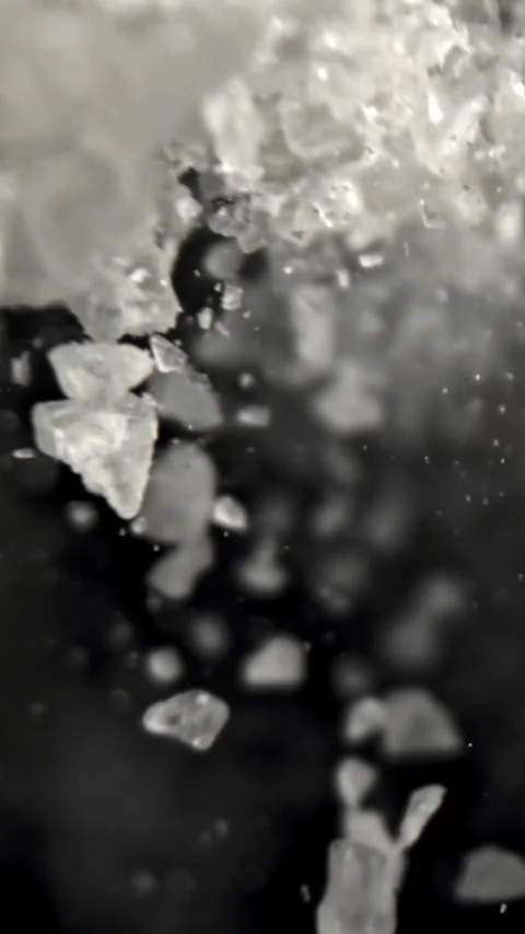 Salt falls down. Filmed on a high-speed camera at 1000 fps Stock Footage 335385179
